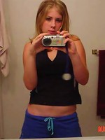 cute innocent girl takes pictures of her body in the mirror